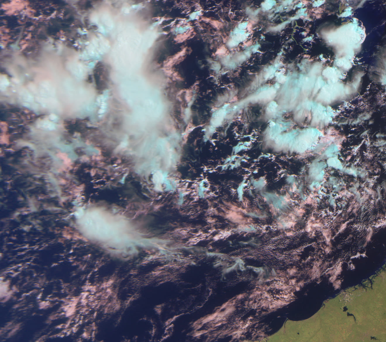 Crop of cloud structure above the Pacific in three-channel false color.